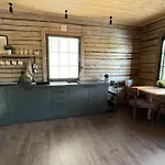 Loghouse By The